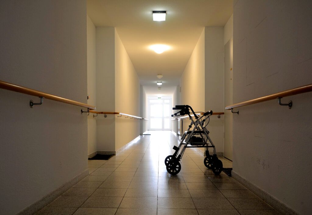 walker sitting in empty hall