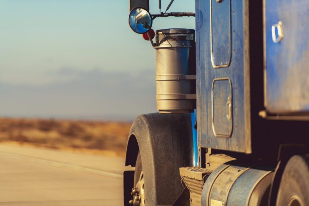 American Semi Truck on the Road. Closeup Photo. Transportation Concept.