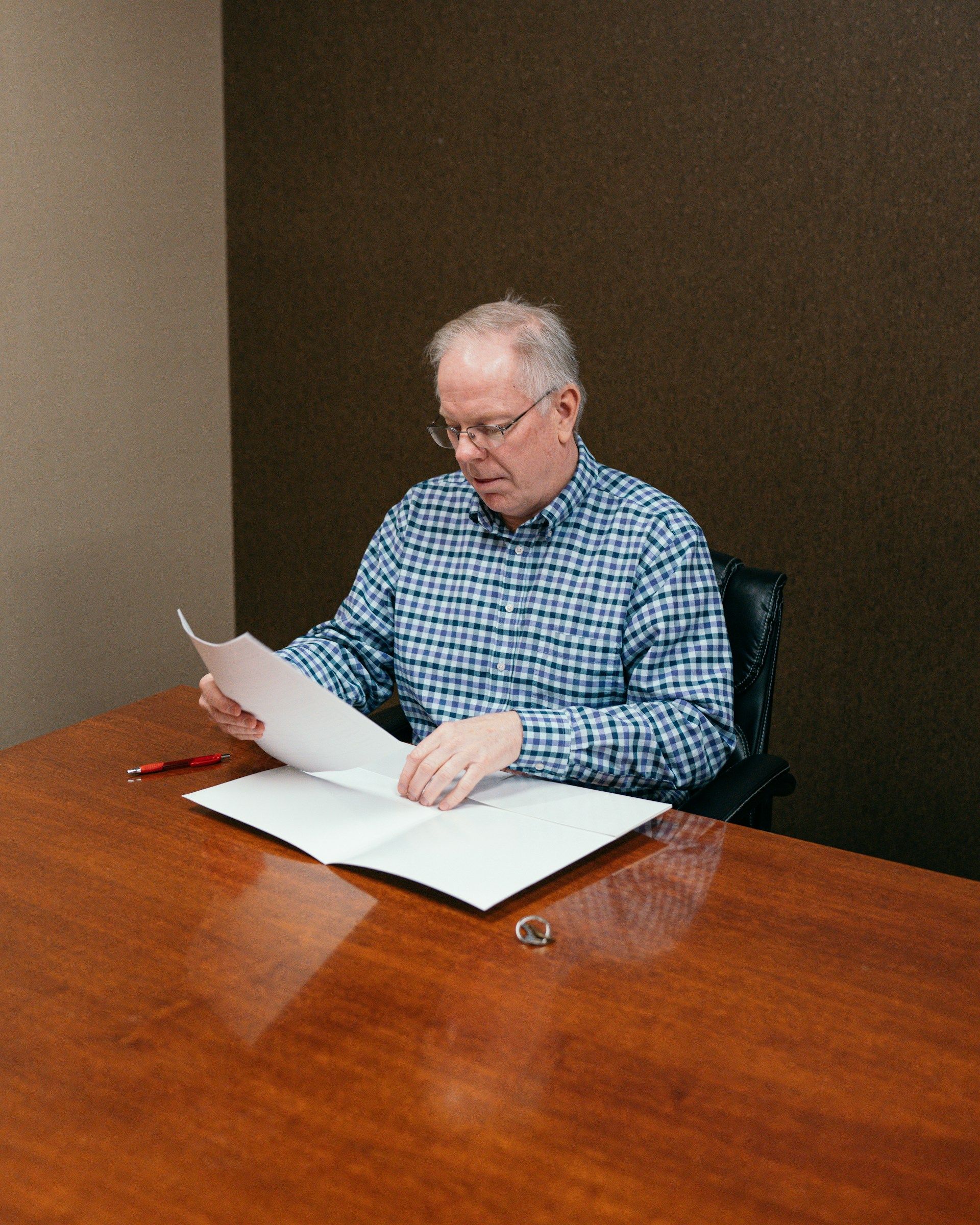 older man reviewing legal documents