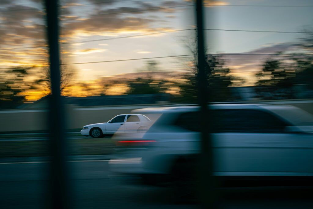two cars speeding in opposite directions